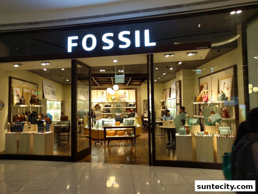 The Fossil store entrance showcases a variety of handbags and accessories displayed attractively.