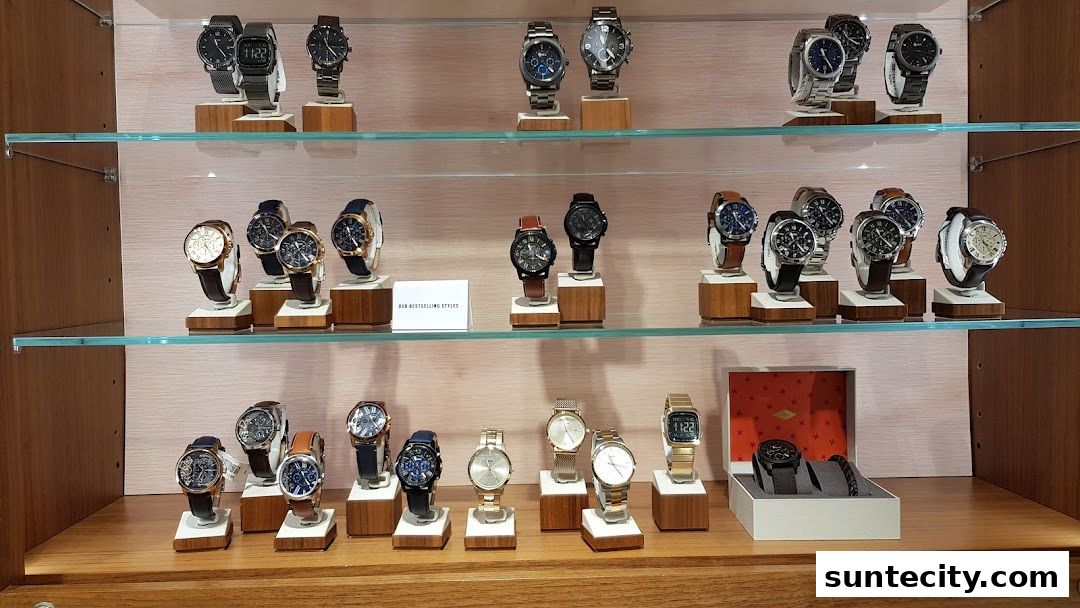 A display of various Fossil watches on shelves, showcasing different styles and designs.