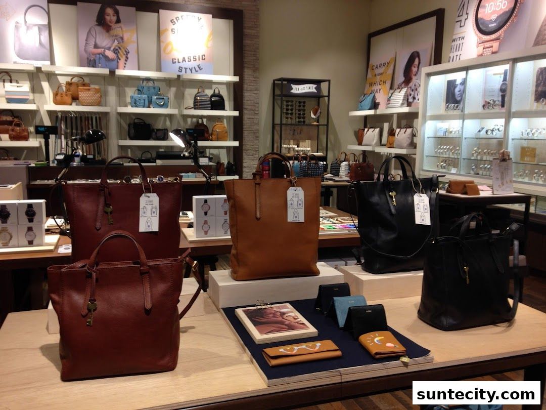 Fossil store interior showcasing leather handbags, wallets, and watches on display.