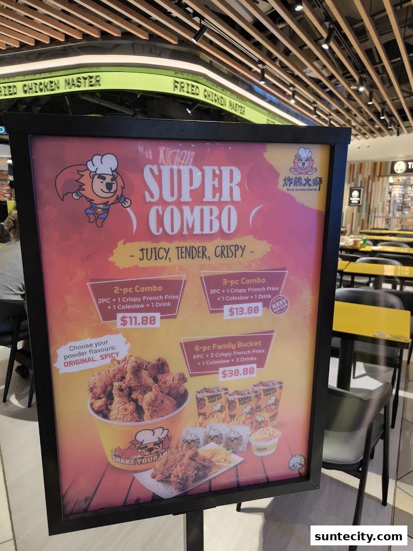 A sign advertising Fried Chicken Master's Super Combo meals with prices and descriptions.