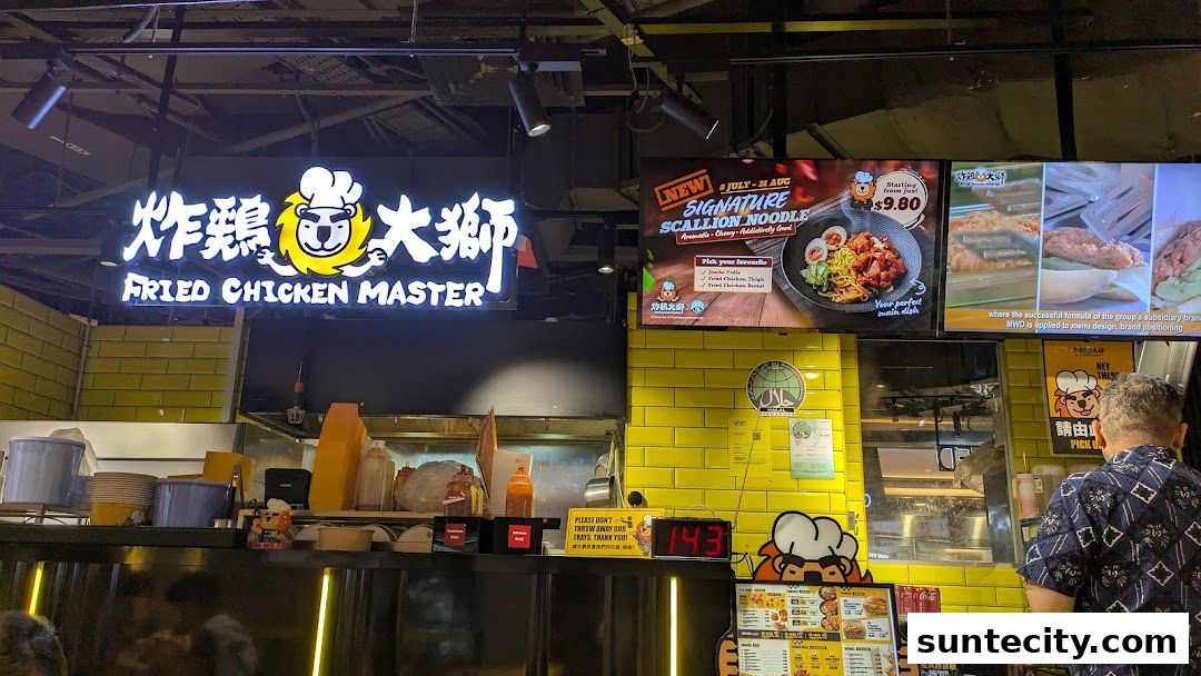 The Fried Chicken Master shop front with a prominent sign and promotional displays.