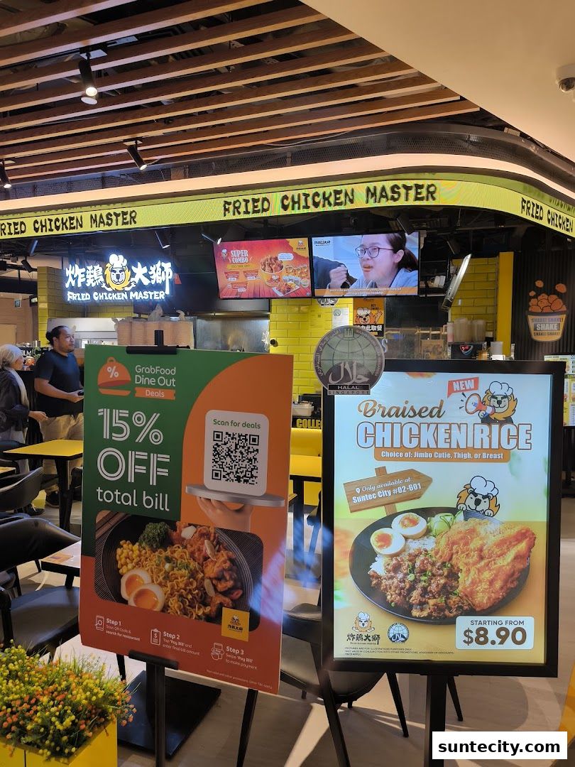 Fried Chicken Master shop front with promotional posters and menu screens.