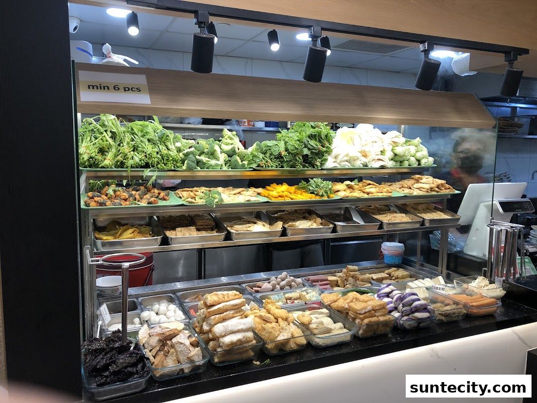 A display of fresh vegetables and various fried ingredients for Yong Tau Foo.