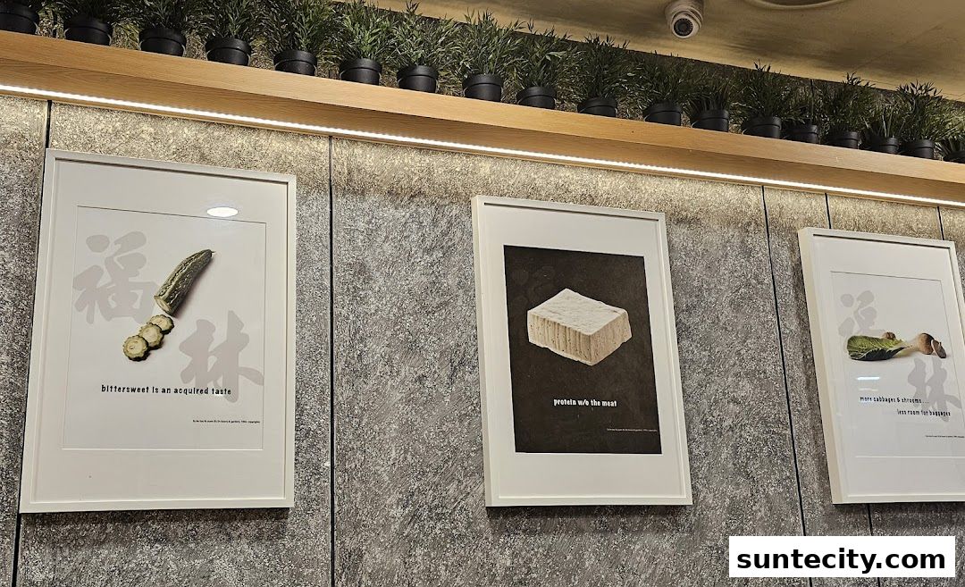 Three framed artworks featuring ingredients like bitter gourd, tofu, and vegetables.