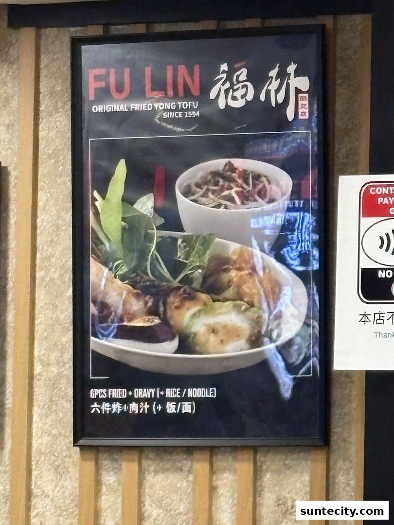 A framed poster advertising FU LIN Original Fried Yong Tau Foo with a dish of food.