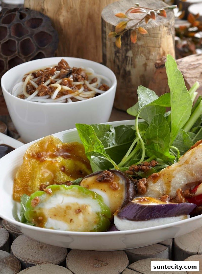 A close-up of a delicious Yong Tau Foo dish with noodles and assorted vegetables.