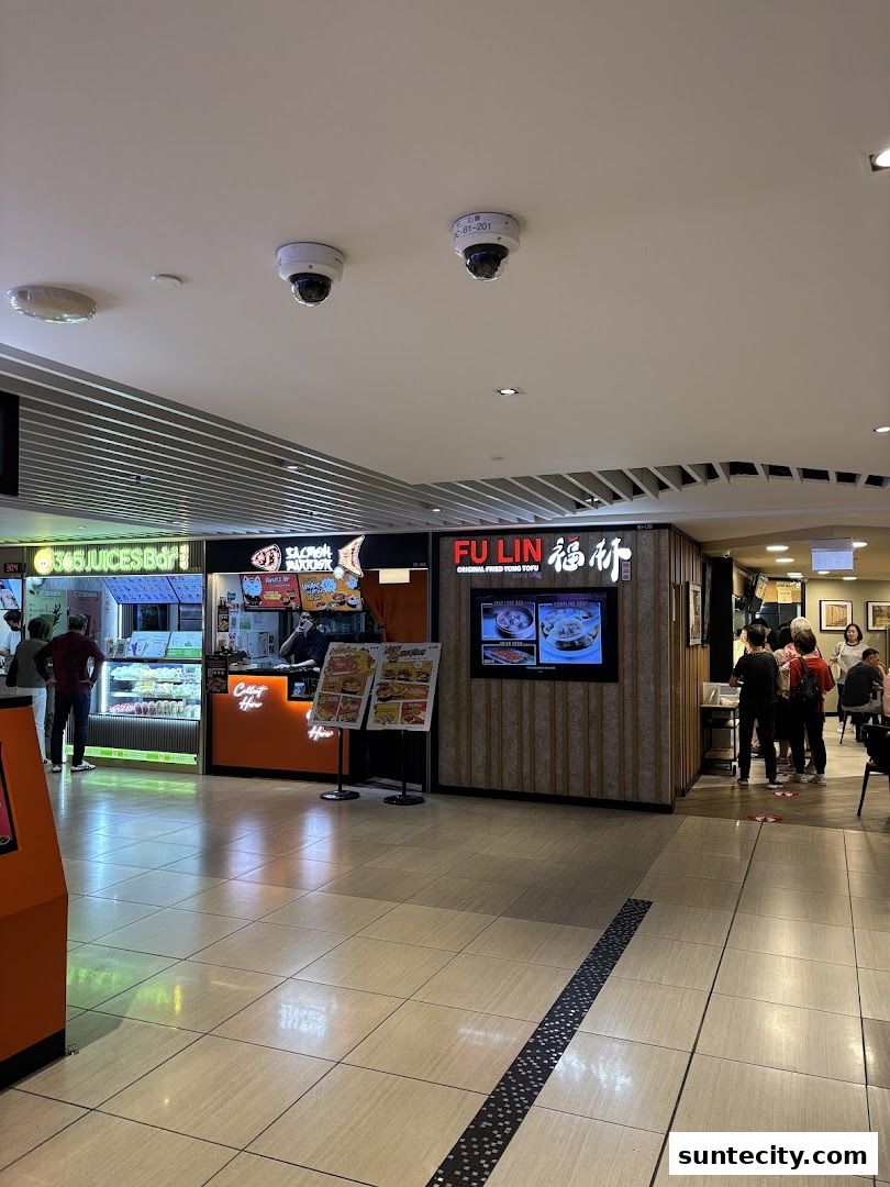 The FU LIN Yong Tau Foo shop front with a display screen and menu boards.
