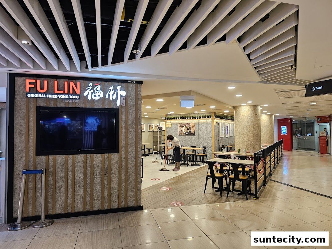 The exterior of FU LIN Yong Tau Foo, a restaurant with a prominent sign and seating area.