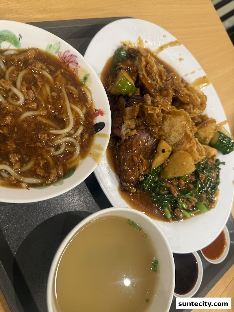 A close-up of three bowls of food, including noodles, vegetables, and soup, from FU LIN Yong Tau Foo.