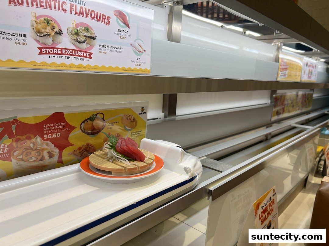 A conveyor belt sushi restaurant with various sushi dishes and desserts displayed.