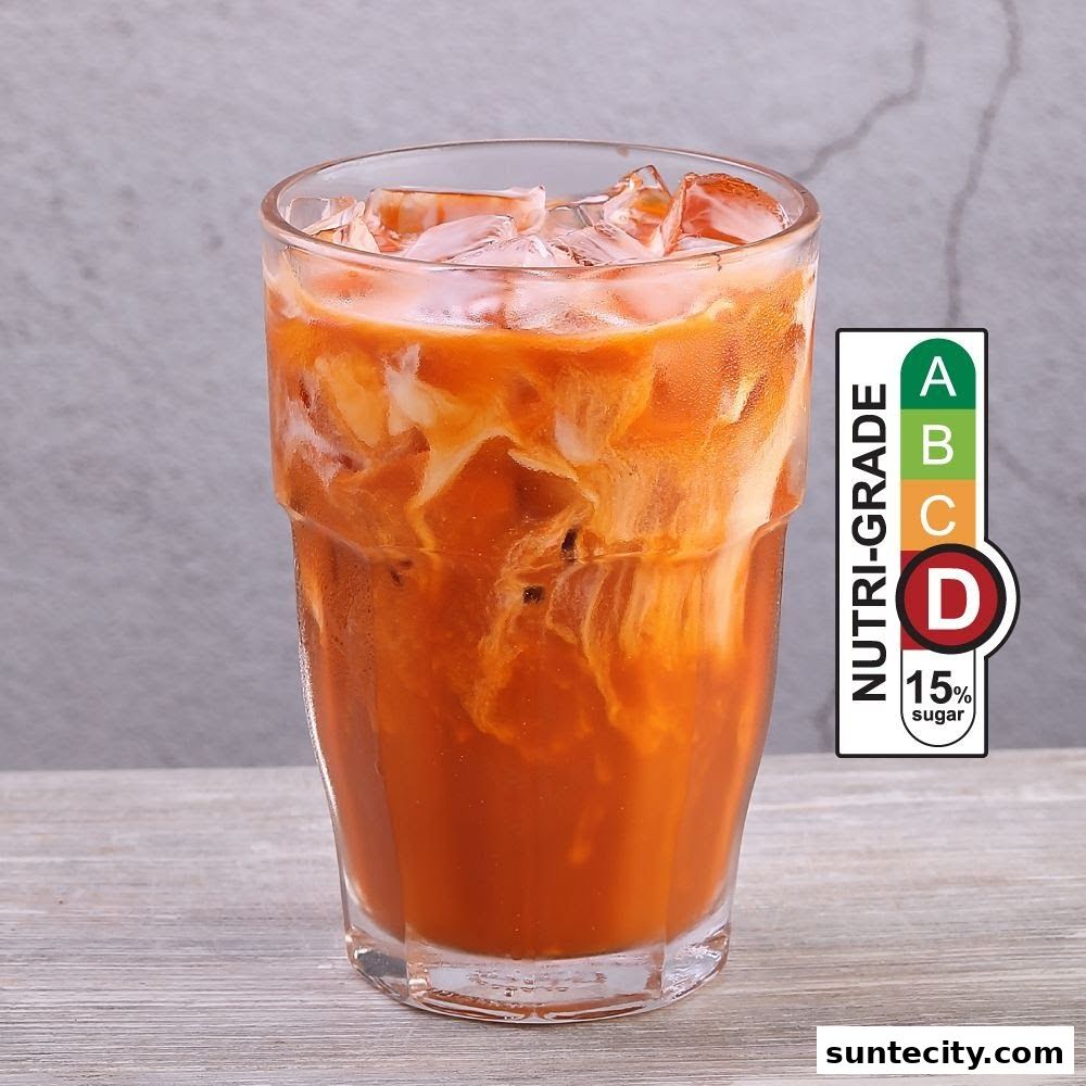 A refreshing glass of Thai iced tea with creamy swirls and ice, featuring a Nutri-Grade D label.