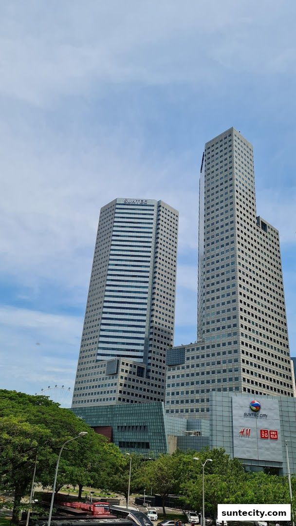 Suntec City buildings with H&M and Uniqlo logos visible.