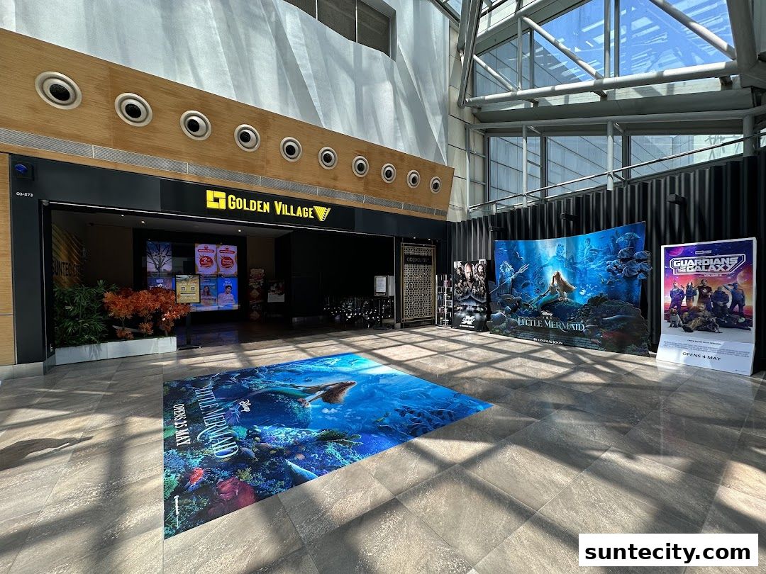 The entrance of Golden Village Suntec cinema with movie posters and floor graphics.