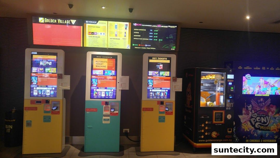 Golden Village Suntec cinema lobby with ticket machines, beverage menu, and movie posters.
