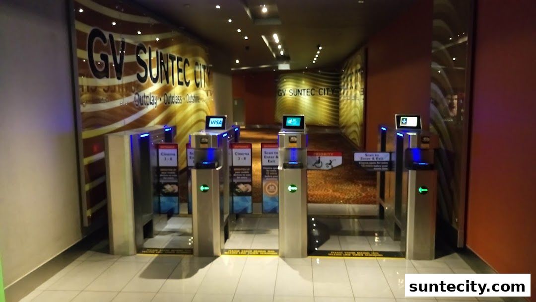 Entrance gates at Golden Village Suntec City cinema with signage and ticket scanners.