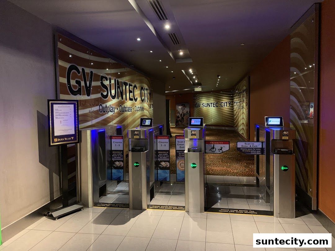 Entrance gates for Golden Village Suntec City cinema with signage and ticket scanners.