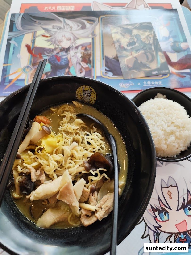 A bowl of mala tang with noodles, meat, and mushrooms, served with rice.