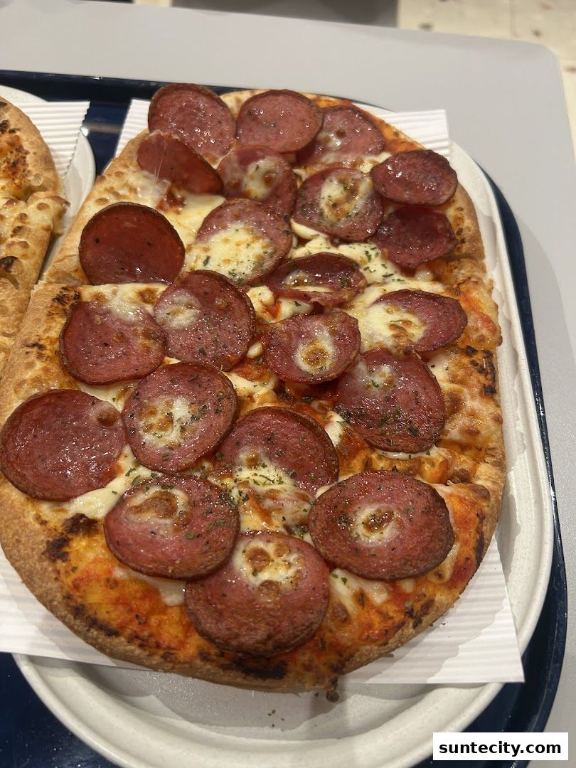 A close-up shot of a delicious pepperoni pizza with melted cheese and herbs.