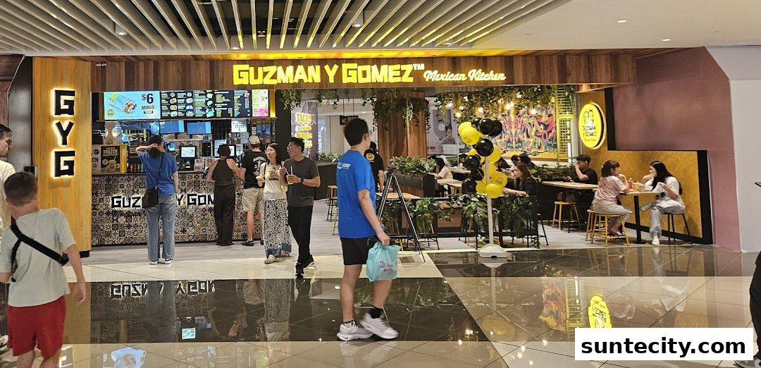 Guzman y Gomez Mexican Kitchen storefront with customers ordering and dining.