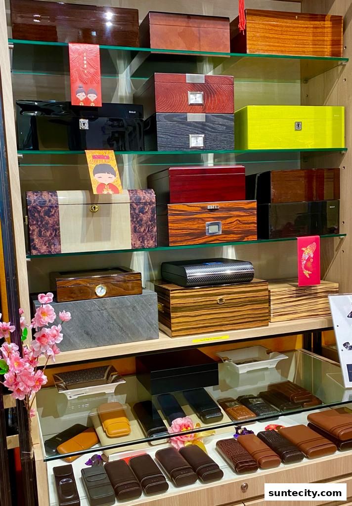A display of various wooden boxes and leather cases, likely for cigars or accessories.