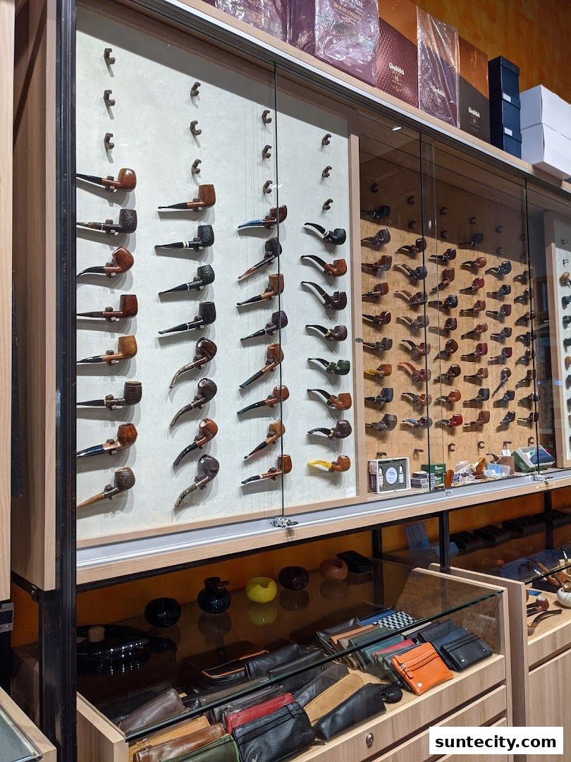 A display of various smoking pipes and accessories in a retail shop.