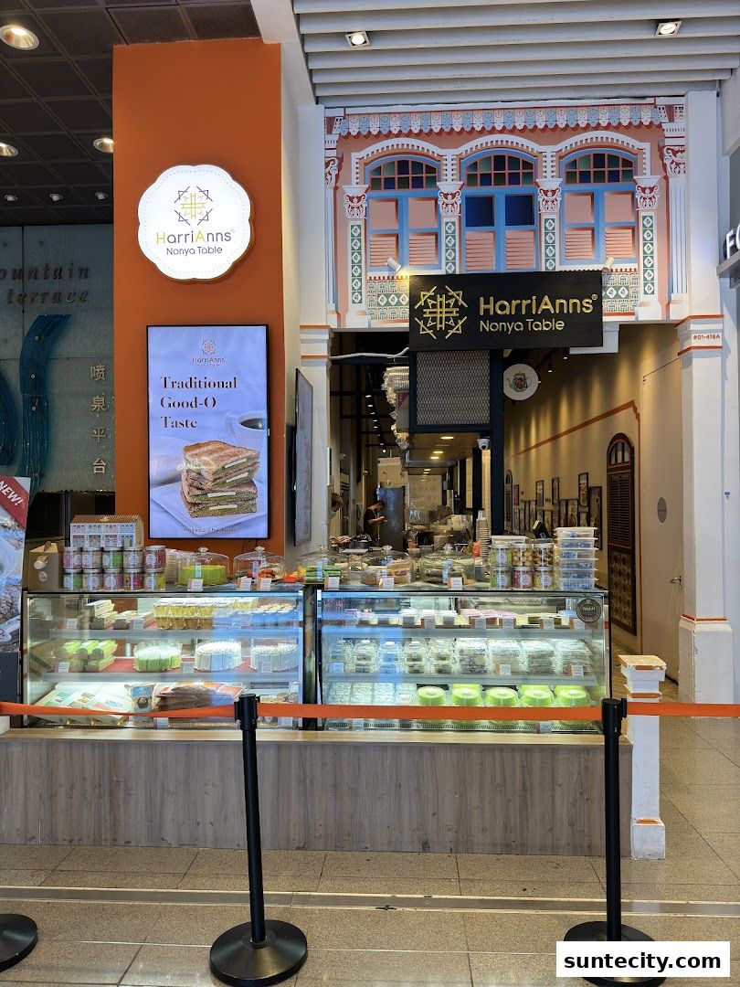 HarriAnns Nonya Table shop front with display cases filled with cakes and pastries.
