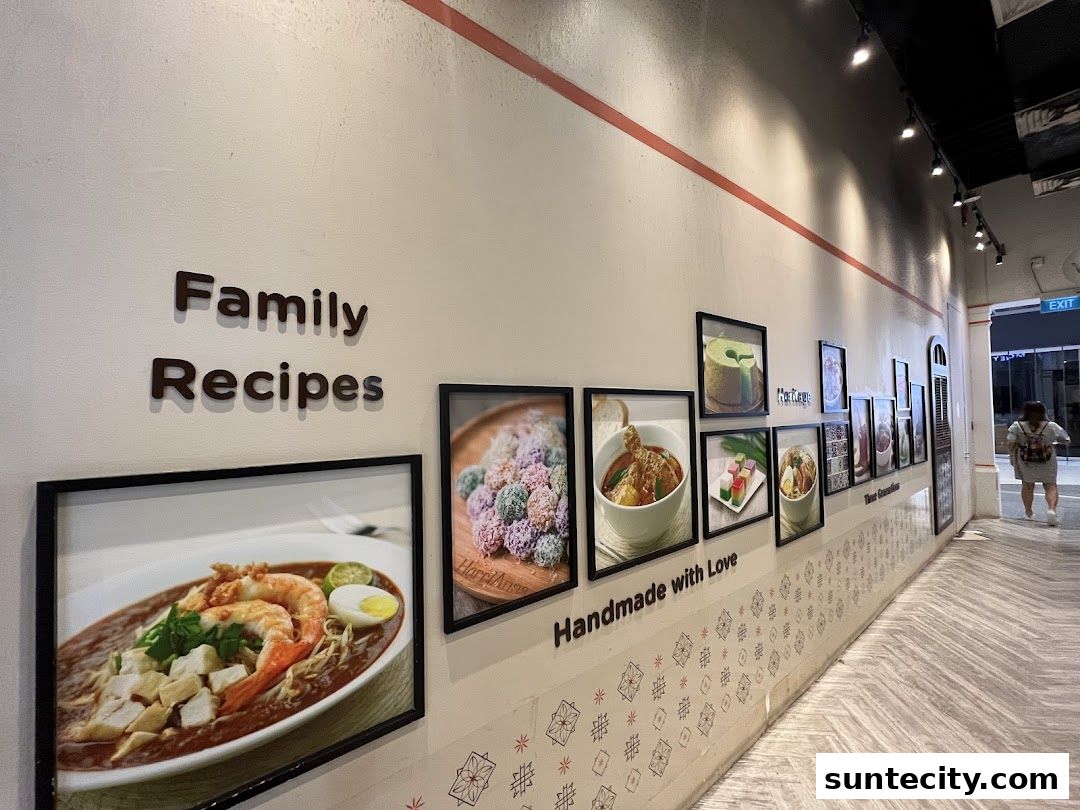 Wall display of framed food photos and text at HarriAnns Nonya Table.
