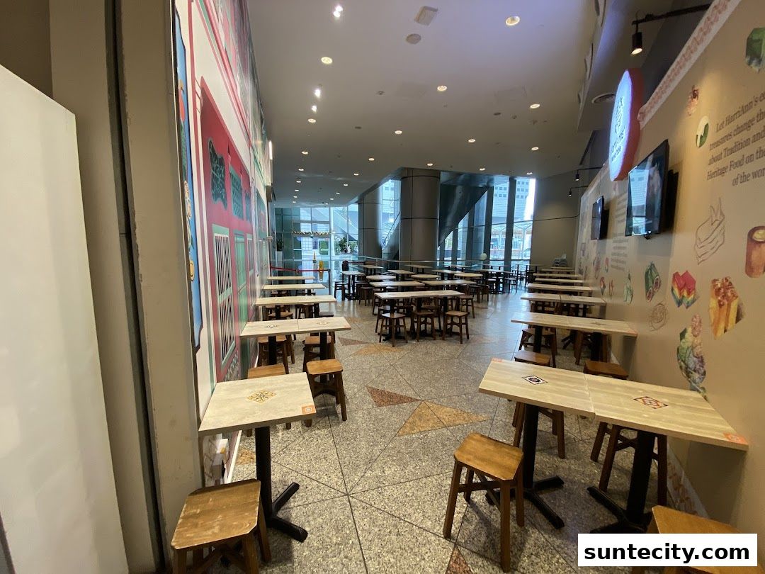 Interior view of HarriAnns Nonya Table restaurant with empty tables and chairs.