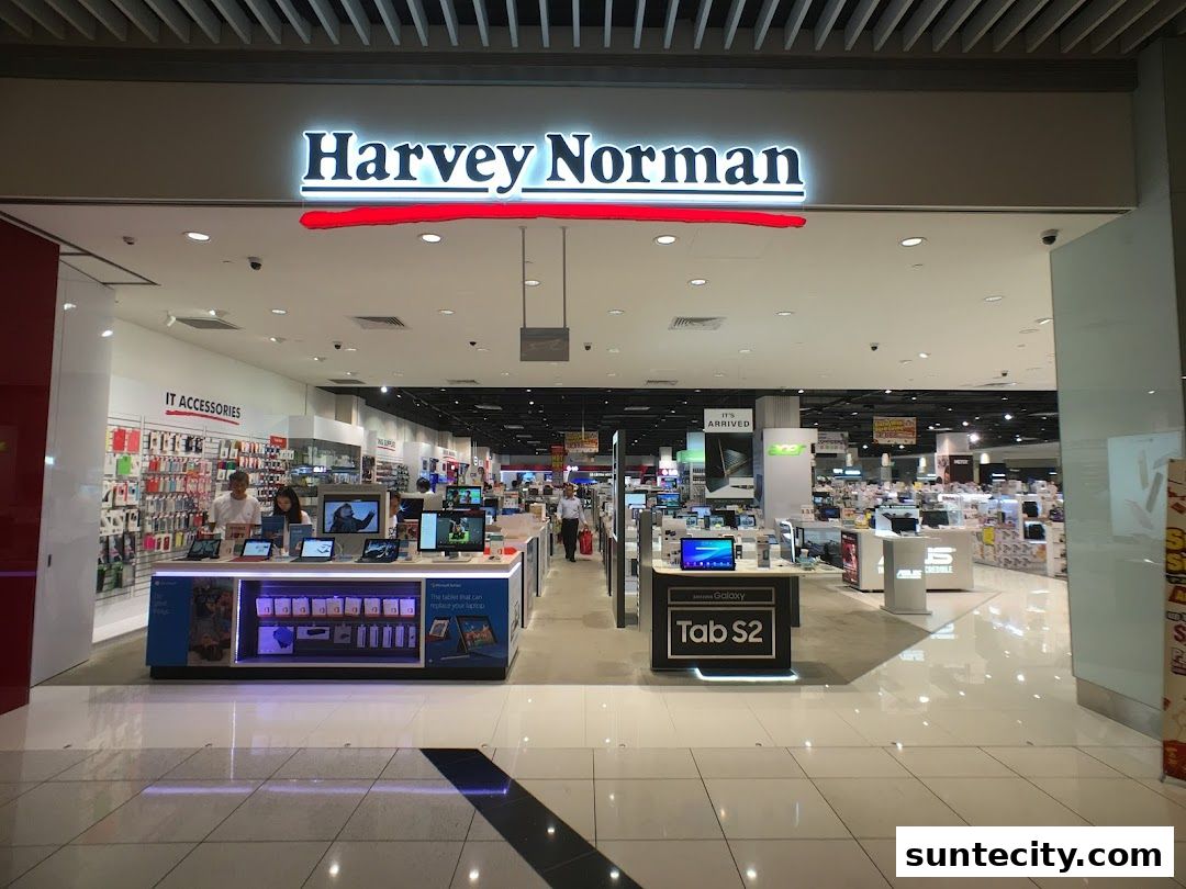 The entrance of Harvey Norman Suntec City, showcasing electronics and IT accessories.