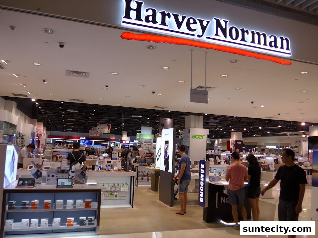 Customers browse electronics and appliances at Harvey Norman Suntec City.