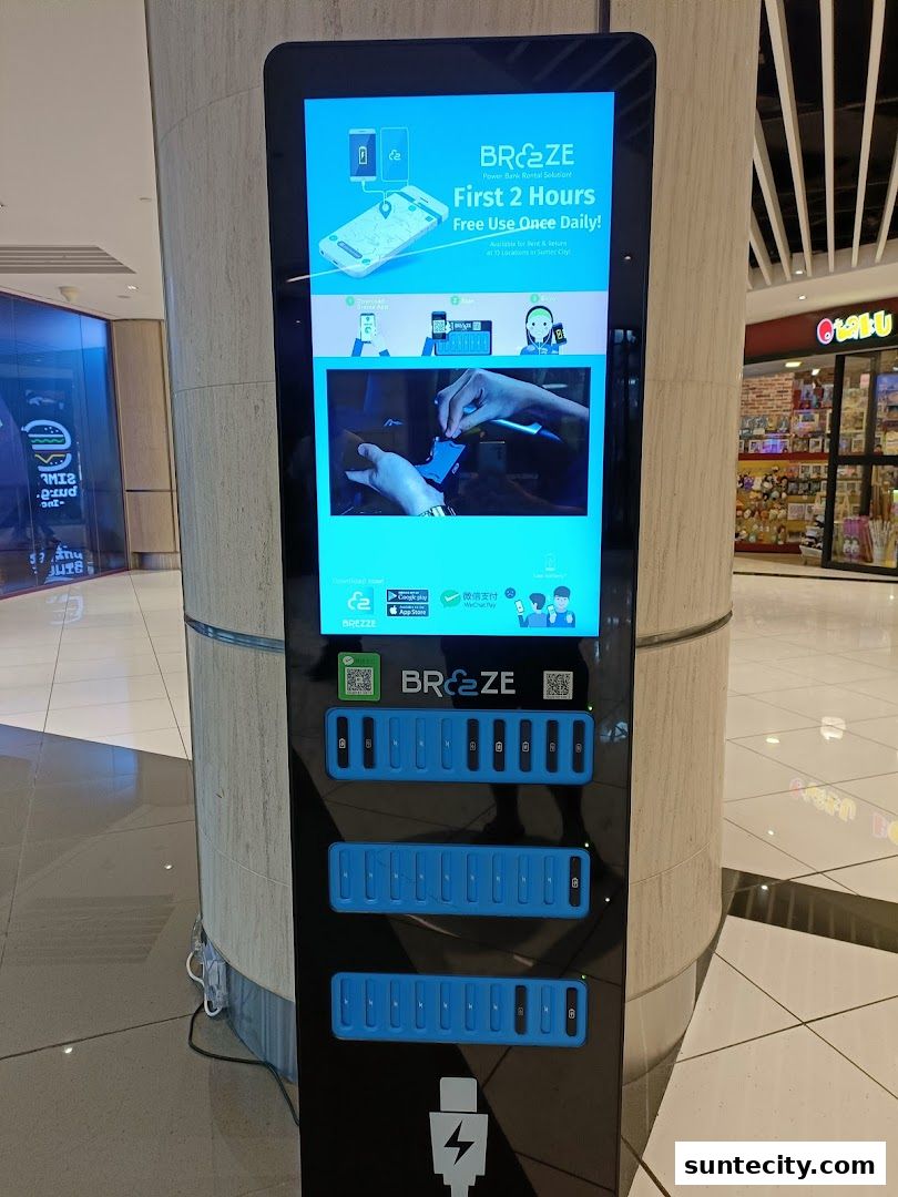 A Breeze power bank rental station with multiple charging slots and instructions.
