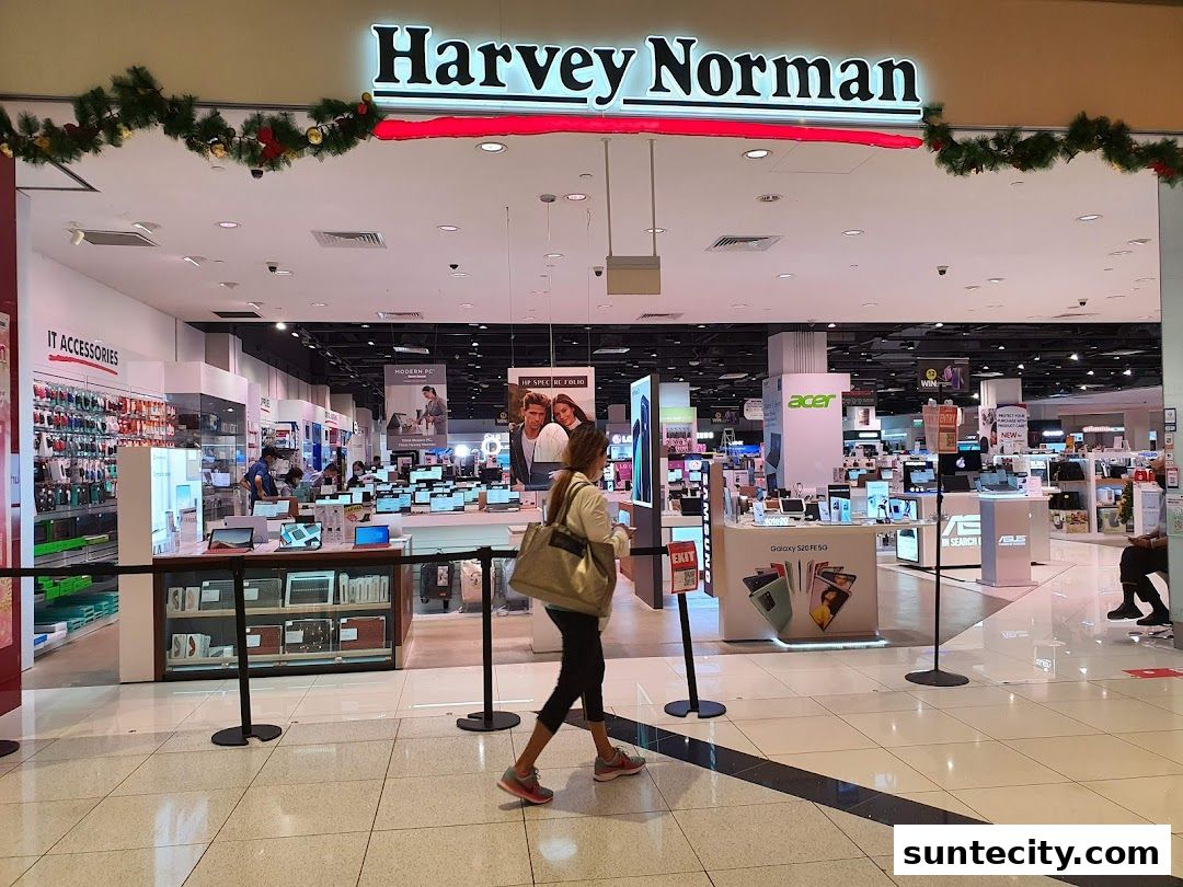 The entrance of Harvey Norman Suntec City, showcasing electronics and IT accessories.