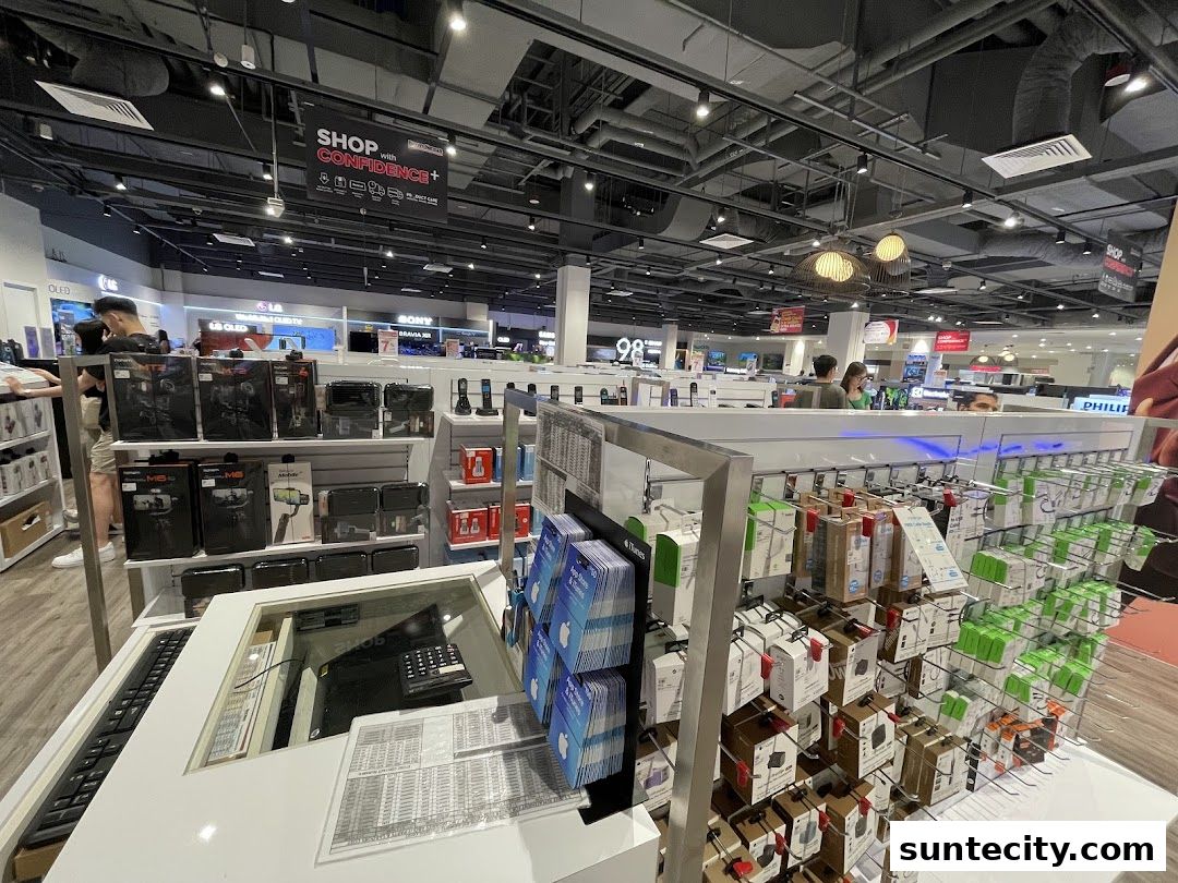 Interior view of a well-stocked electronics store with various gadgets and accessories on display.
