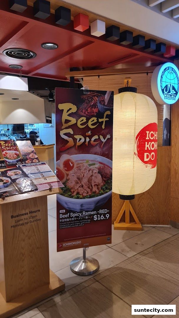 A sign advertising Beef Spicy Ramen outside Ichikokudo Hokkaido Ramen, with a large lantern.