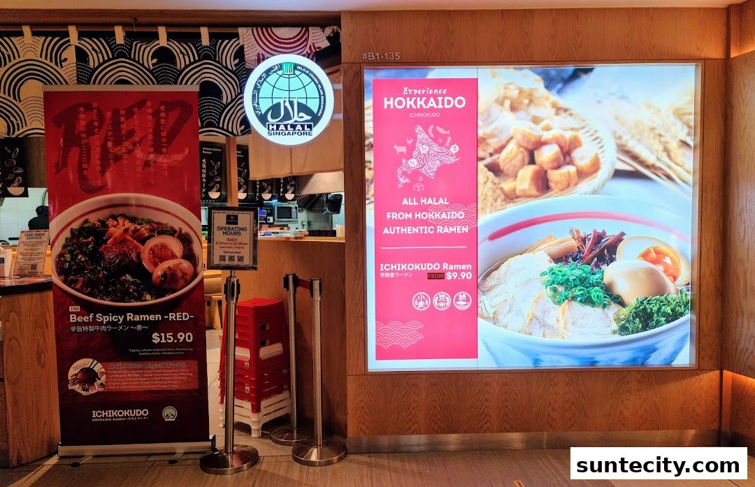 Ichikokudo Hokkaido Ramen shop front with a banner advertising Beef Spicy Ramen and a large illuminated sign.