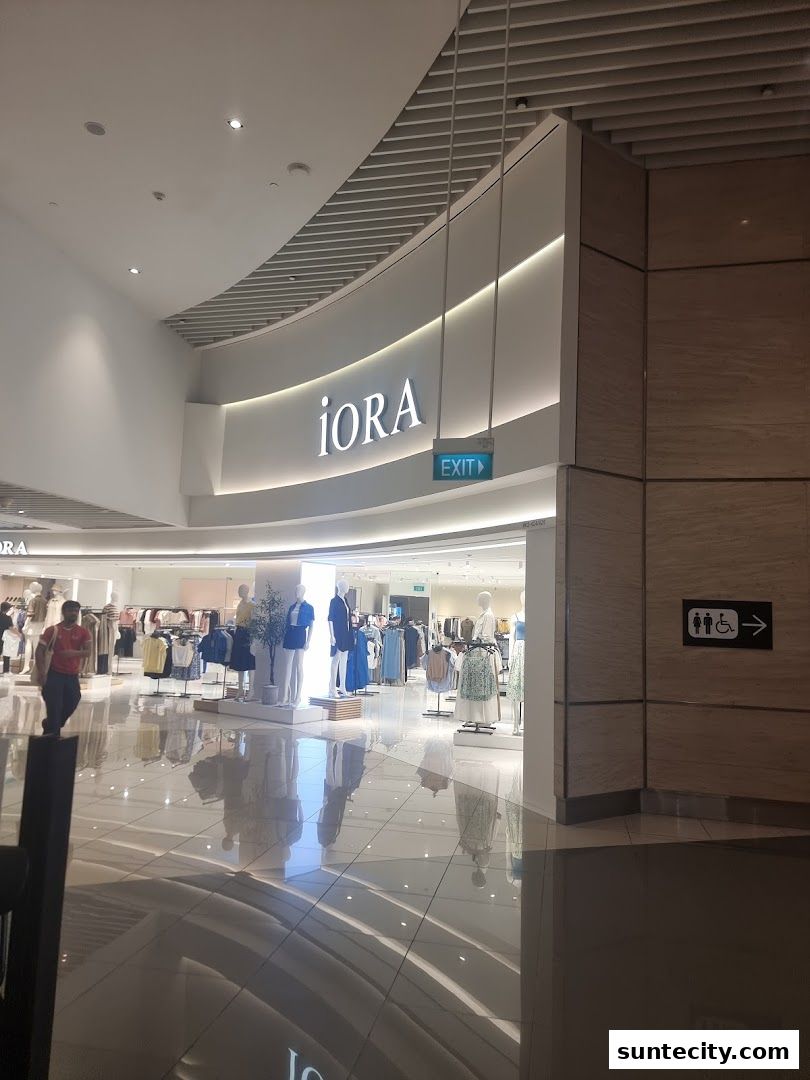 The iORA store at Suntec City, showcasing fashion displays and mannequins.