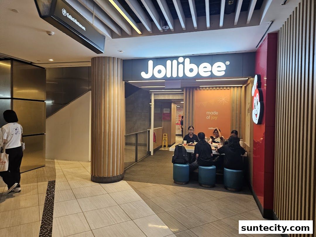 The Jollibee Suntec City store entrance with customers dining inside.