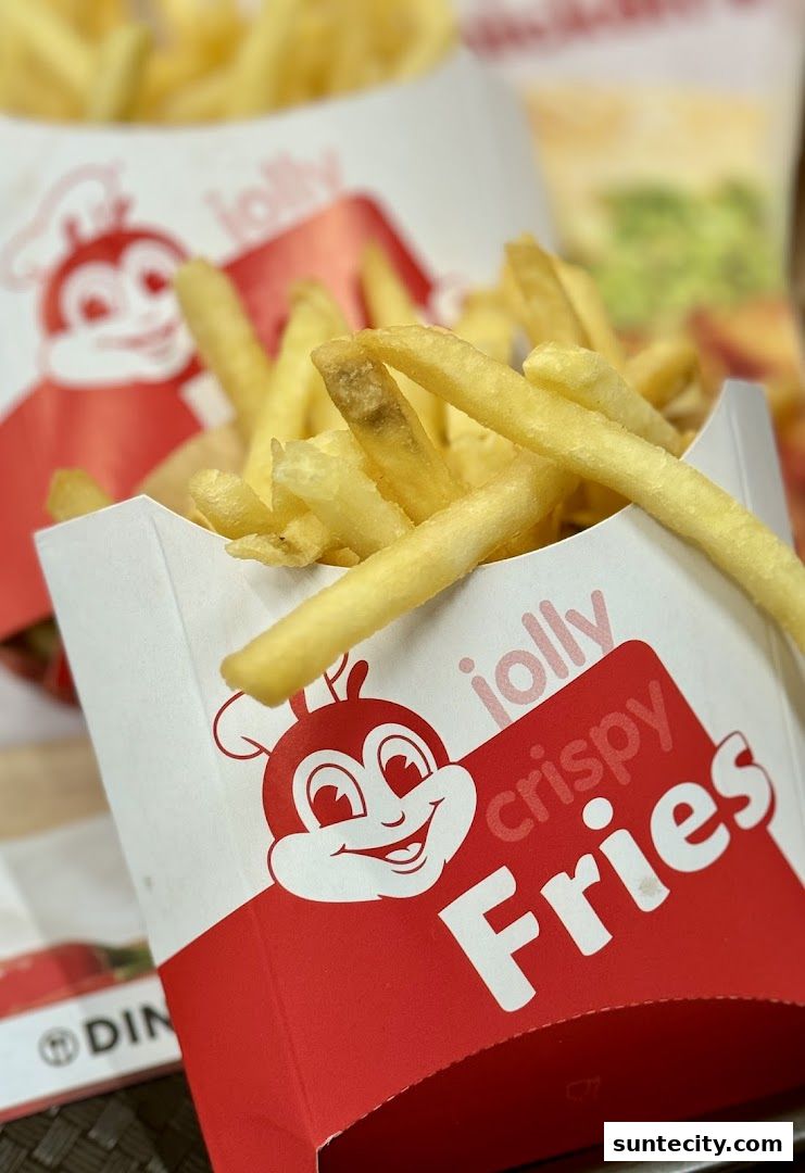 Close-up of Jollibee's crispy fries in branded packaging.
