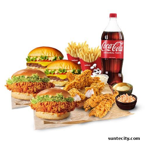 A spread of Jollibee meals including burgers, chicken tenders, fries, and a soda.