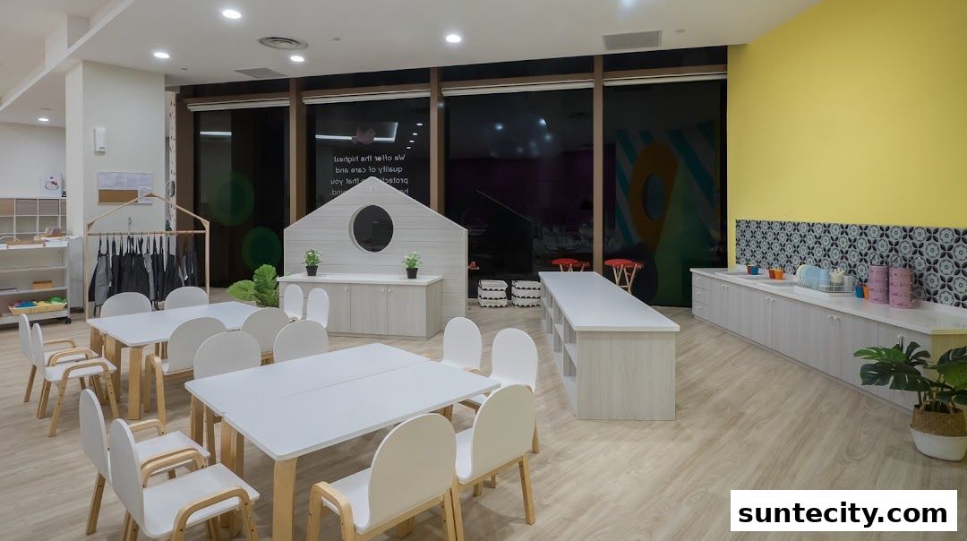 A bright and spacious classroom with tables, chairs, and a sink area.