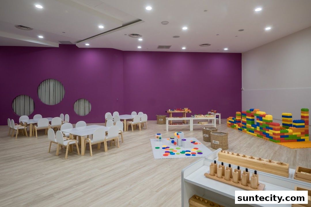 A bright, spacious classroom with tables, chairs, and educational toys for children.