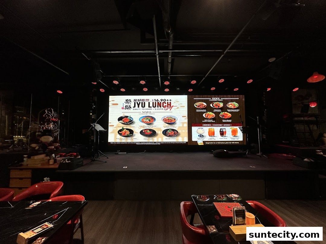 A large screen displays a lunch menu for Jyu Lae Bistro with food and drink options.