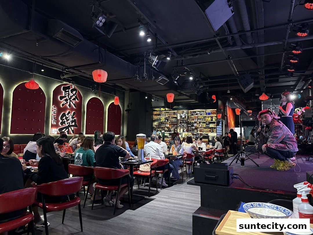 A lively bistro with patrons dining and a performance on stage.