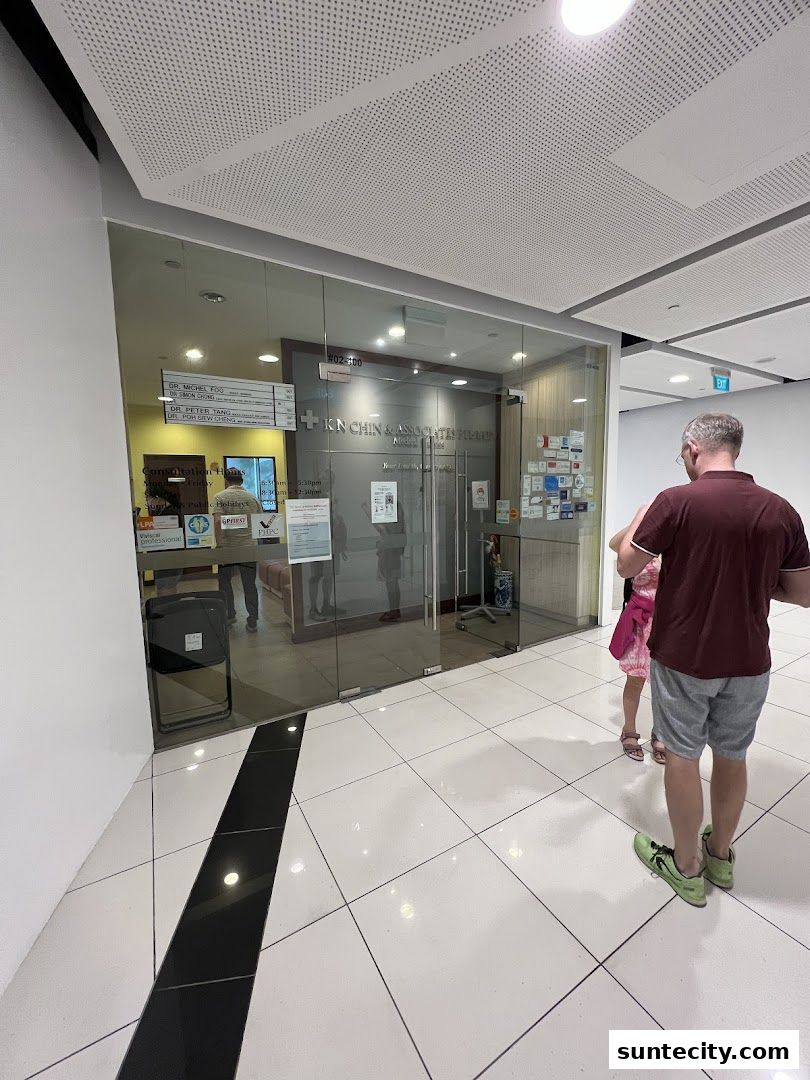 The entrance to K N Chin & Associates, a professional clinic with glass doors and signage.