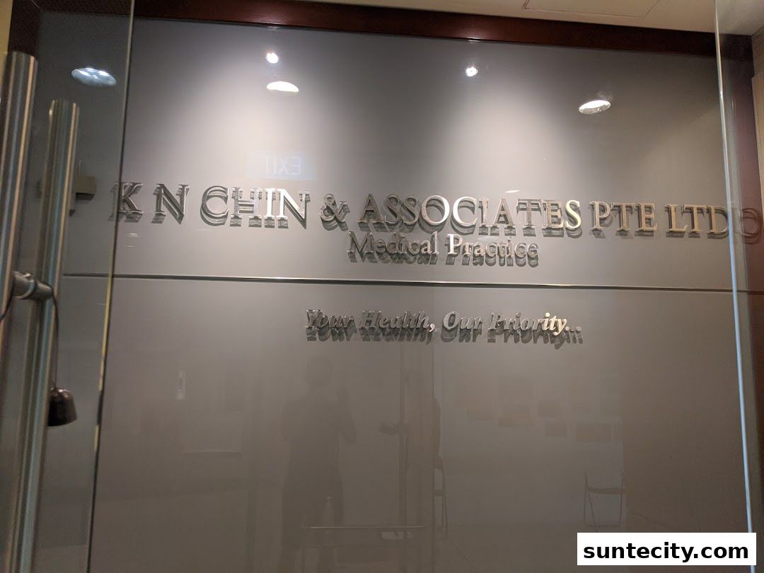 The entrance to K N Chin & Associates, a medical practice, with its name and slogan displayed.