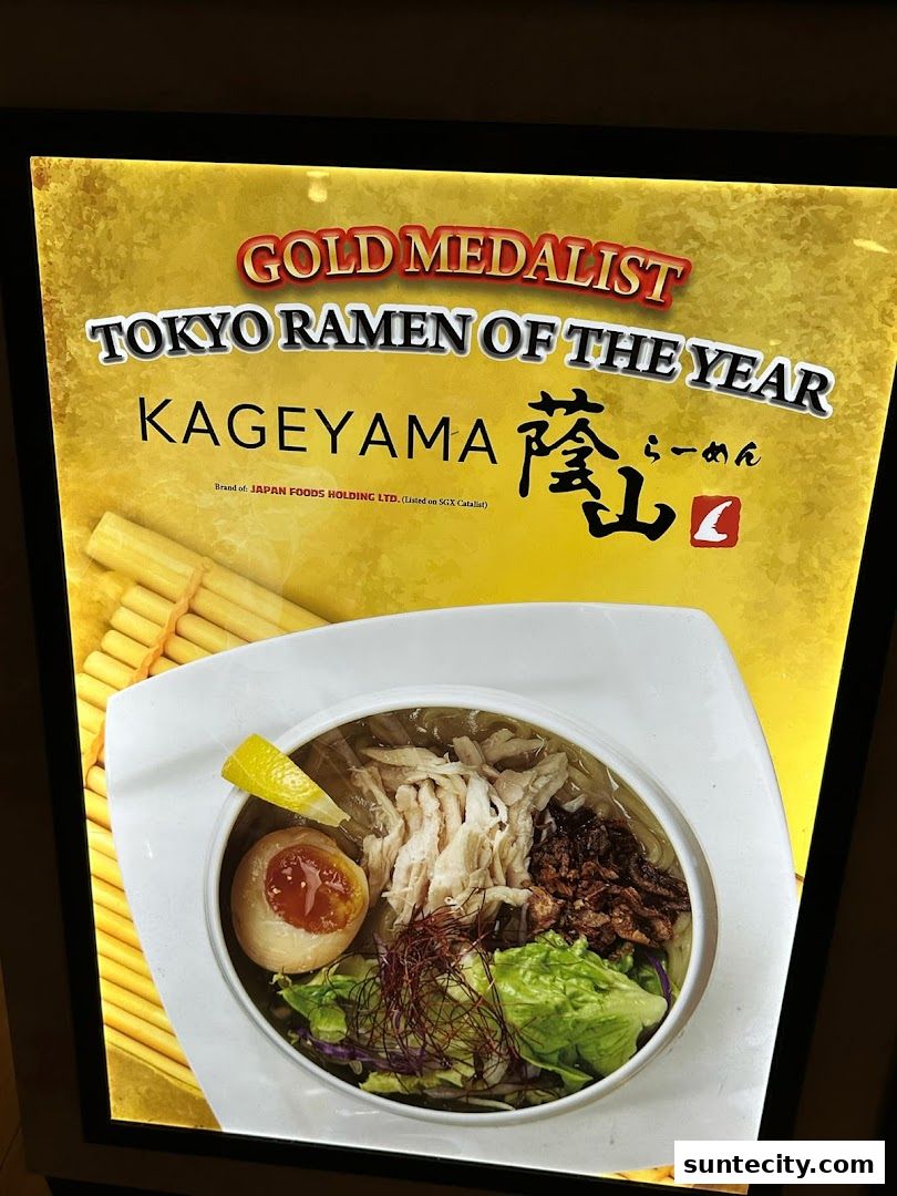 A glowing sign advertising Kageyama ramen, a gold medalist Tokyo Ramen of the Year.