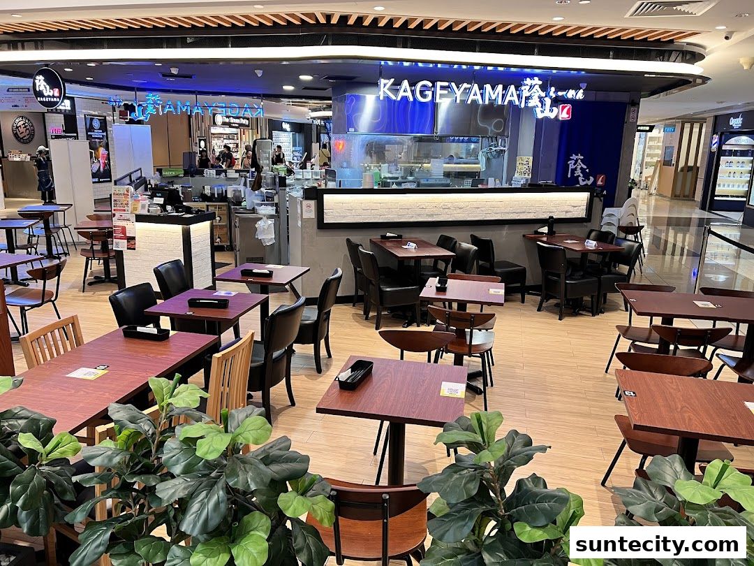 Interior view of Kageyama restaurant with tables and chairs, and the counter area.