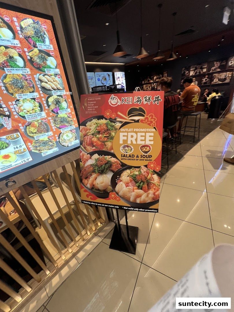 A promotional sign for Kei Kaisendon offering a free salad and soup with any main dish.