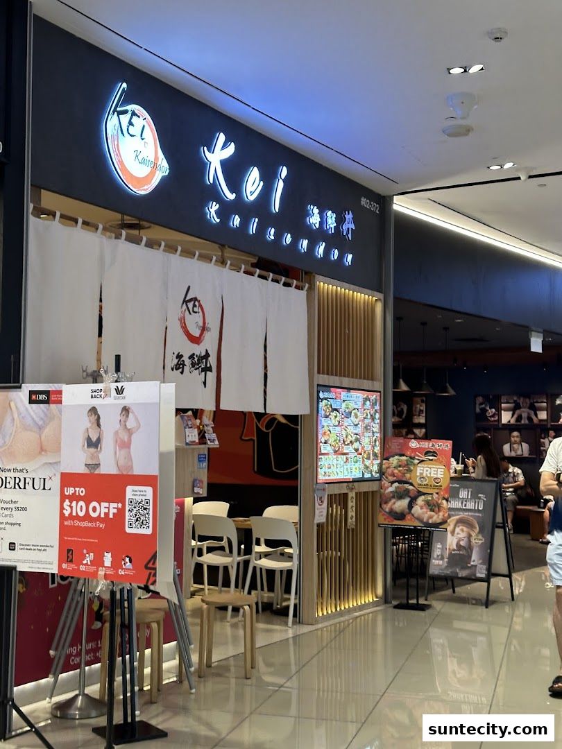 The exterior of Kei Kaisendon Suntec City, a Japanese restaurant with a prominent sign and menu displays.