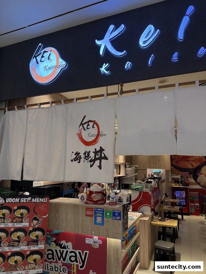 The exterior of Kei Kaisendon Suntec City, featuring its illuminated sign and entrance curtains.